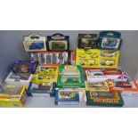 A collection of die-cast model vehicles including a Welly military vehicle set, two AA sets, a