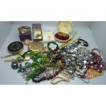 A collection of costume jewellery, compacts and wristwatches