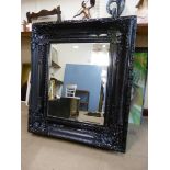 A large black lacquered mirror