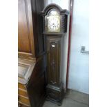 An early 20th Century oak dwarf longcase clock