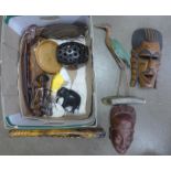 A collection of wooden items including carved African masks, etc.