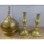 Two brass candlesticks and an Indian brass censer