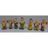A set of vintage Seven Dwarfs figures, (Grumpy lacking arm, Dopey chipped), Doc 10cm