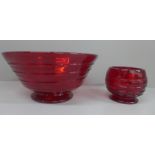 Whitefriars glass ruby red bowl with ribbon trail and a similar smaller footed bowl, largest