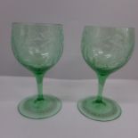 A pair of green wine glasses, engraved with rococo design, circa 1880, possibly Austro-Hungarian