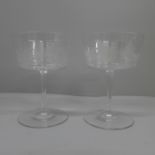 A pair of circa 1890 English bucket bowled champagne glasses, acid etched with sea creatures