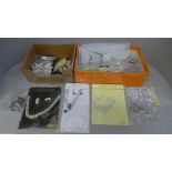 Two boxes of costume jewellery, lncluding large butterfly brooches and carded necklace sets