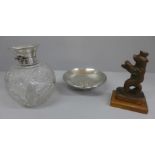A silver topped glass scent bottle, hinge a/f, a dish marked 24K GP and a metal model of a bear,