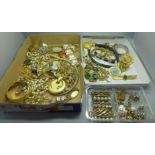 A collection of gold tone costume jewellery including a sphinx brooch