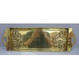 An Art Nouveau brass tray, 52cm