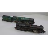 Two 00 gauge locomotives, Tri-ang Green 92220 Evening Star and Hornby BR Black 80033