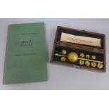A Sikes hydrometer, boxed, with book