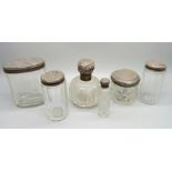 Six silver topped glass jars and bottles, some tops a/f