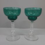 A pair of circa 1850 green pan topped bowl wine glasses with cut stems
