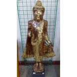 An eastern gilt figure of a deity