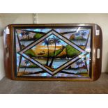 A Brazilian inlaid mahogany tray with reverse painted glass and butterfly wings