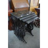 A Chinese black lacquered chinoiserie nest of quartetto tables