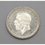 A George V 1927 3d coin, uncirculated