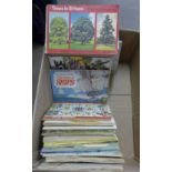 A box of tea card albums