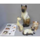 A Beswick siamese cat and three other figures of cats and five Cats Protection League first day