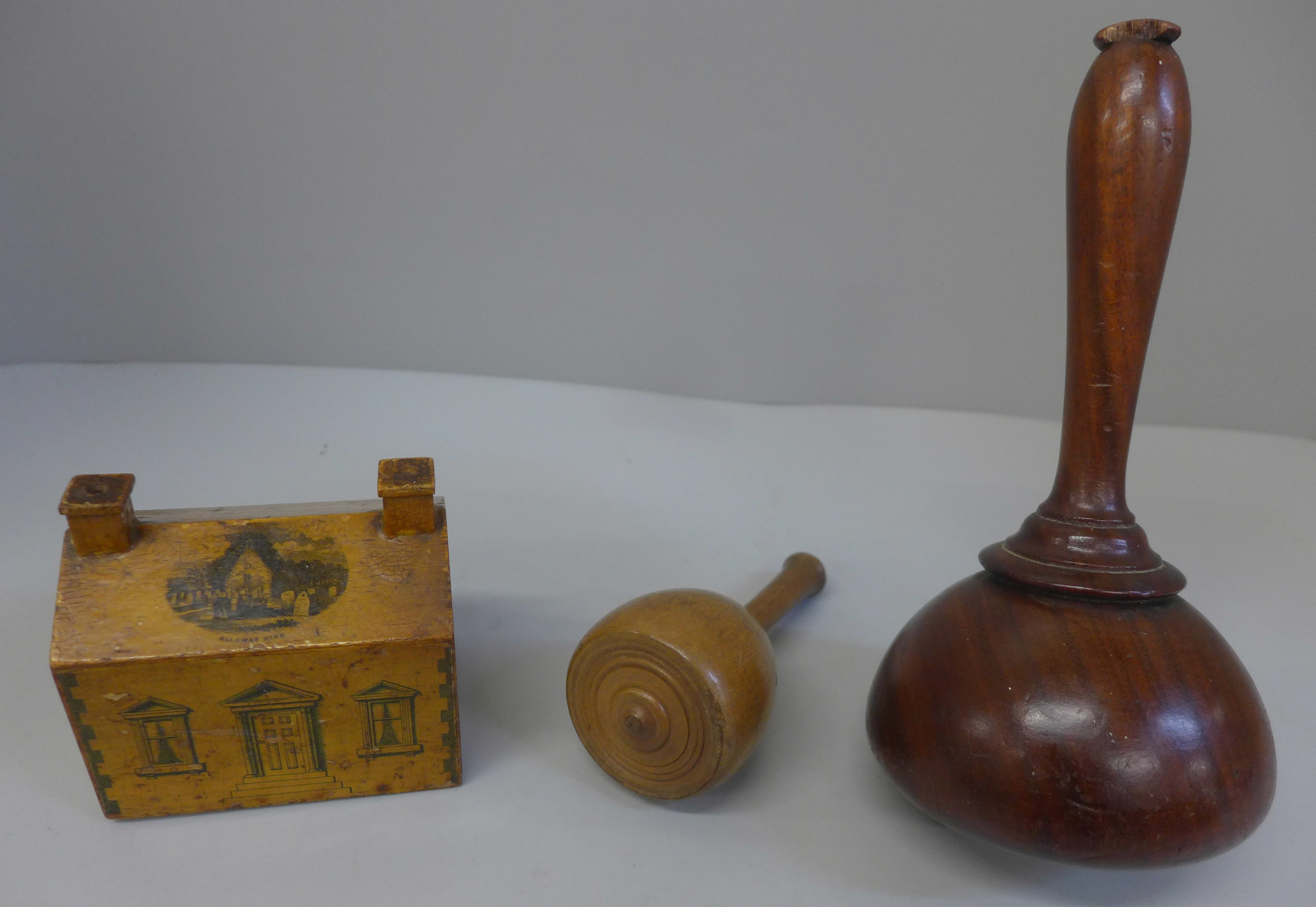 Two wooden mallets and a treen money bank