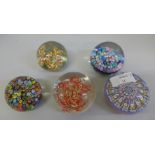 Five glass paperweights including three Millefiori