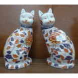 A pair of oriental Imari cat figures. 26cm, each with six character mark to the base