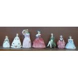 Seven Royal Doulton figures including Miss Demure and Genevieve