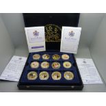 A boxed set of 12 Diamond Wedding Queen Elizabeth and Prince Philip portrait coins, with