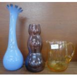 A Whitefriars lemon glass jug, a 1960's amethyst glass vase and a pale blue tall glass vase