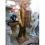 A painted figural fibreglass cabinet, in the form of Albert Einstein holding books