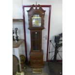 A hardwood triple weight longcase clock