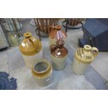 Four stoneware flagons and one other