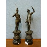 A pair of spelter figures of Roman soldiers, on ebonised socles