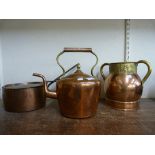 A Victorian brass and copper kettle, a copper saucepan and a copper and brass two handled vessell