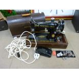 A Singer sewing machine, wiring updated and working including accessories, zigzager, feet, Singer