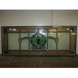 An Art Nouveau stained glass window pane