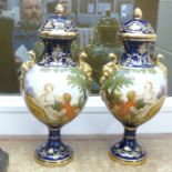 A pair of Limoges cobalt blue lidded vases with transfer printed and painted portrait decoration and