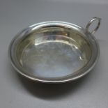 A silver wine taster, Birmingham 1923, 39g, (small dent)