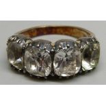 A c1900 ring set with four white stones, O