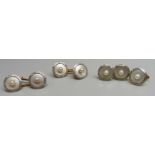 Three yellow metal and pearl studs and a pair of cufflinks, 13.6g