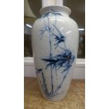 An oriental blue and white vase decorated with bamboo, unmarked base, crackle glaze, 32cm