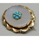 A yellow metal and turquoise set brooch