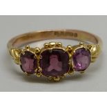 An almandine garnet set ring, circa 1900 but with later 9ct gold half shank, 1.8g, N