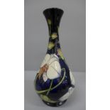 A Moorcroft Chatsworth Orchid pattern vase, designed by Philip Gibson, 125/350, 23.5cm