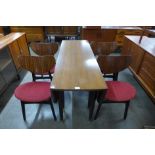 A G-Plan Librenza tola wood and black drop leaf dining table and four butterfly-back chairs