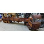 A hand built wooden articulated lorry with trailer