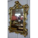 A 19th Century carved giltwood Florentine mirror, 107cms h