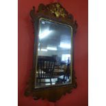 A George II mahogany and parcel gilt framed mirror, 89cms h