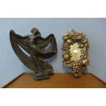 An Art Deco style plaster figure of a lady and a gilt mirror